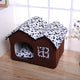 Brown pet house with a leopard print cover on wooden floor.