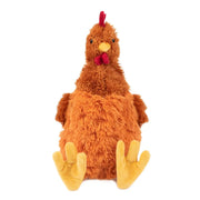 Front view of a sitting brown plush chicken dog toy with big yellow feet
