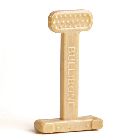 Professional studio shot of a tan Bullibone nylon dog toy isolated on white.