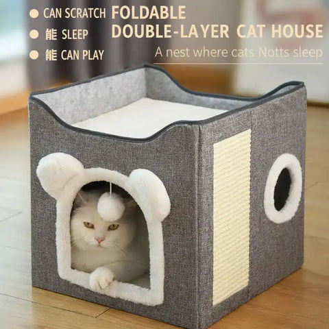 Cat bed with a cat inside on wooden floor.