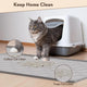 Longhaired cat exiting hooded litter box onto a grey litter collector mat