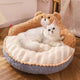 Cat lying on fluffy bear-shaped pet bed with soft texture.