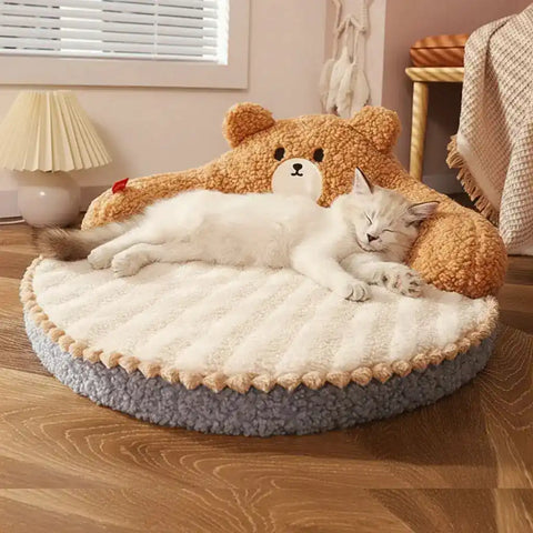 Cat lying on fluffy teddy bear-shaped pet bed in cozy room.