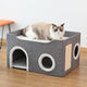 Cat sitting on a gray cat house with a white background.