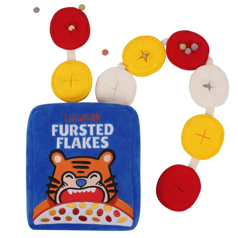 Chewffon Fursted Flakes plush cereal box dog toy with an attached interactive snuffle loop chain for hiding treats.
