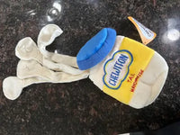 Customer review image of the Chewffon Tail Mayonnaise plush jar dog toy laid out on a dark countertop with its snuffle strips fully extended.