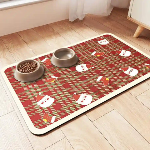 Holiday-themed red plaid pet feeding mat featuring Santa Claus and Christmas stocking illustrations.