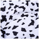 Close-up of a black and white cow print fabric.