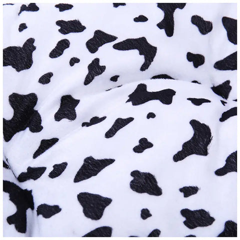 Close-up of a black and white cow print fabric.