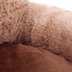 Close-up of a brown textured fabric surface.