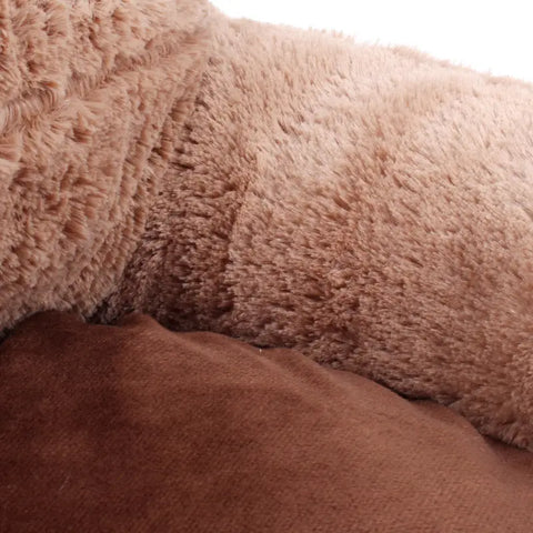 Close-up of a brown textured fabric surface.