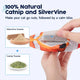Close-up of catnip and silvervine pouch inserted into the belly pocket of the orange clownfish toy.