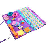 Colorful educational dog toy with shapes on a purple sniff mat for mental enrichment