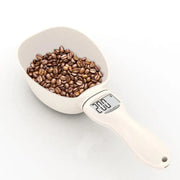 Digital weight spoon with pet feed-themed design and clear display for portion control
