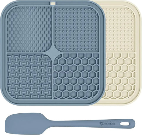 Dark blue and beige  silicone dog lick pads with an included application spatula