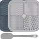 Two-pack silicone dog lick mats in grey and dark blue with a matching grey spatula.