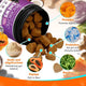 Heart-shaped dog chews spilling out of a jar with callouts to ingredients like pumpkin, papaya, inulin, and Bacillus subtilis bacteria.