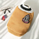 Dog sweater with a brand logo on light background.