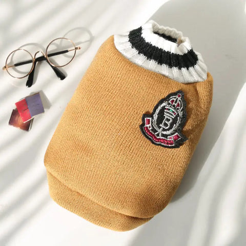 Dog sweater with a brand logo on light background.