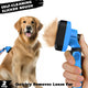 A close-up demonstration of a hand peeling away a solid layer of pet hair from a retractable blue grooming brush.