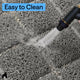 Close-up of water hose rinsing litter debris off a gray mesh cat litter trapping mat