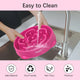 Person washing a pink MateeyLife slow feeder bowl under a faucet highlighting non-toxic and eco-friendly materials.