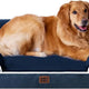 Navy blue EHEYCIGA orthopedic memory foam dog bed with white rim piping and Golden Retriever