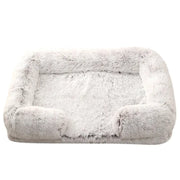 Fluffy gray pet bed on a white background