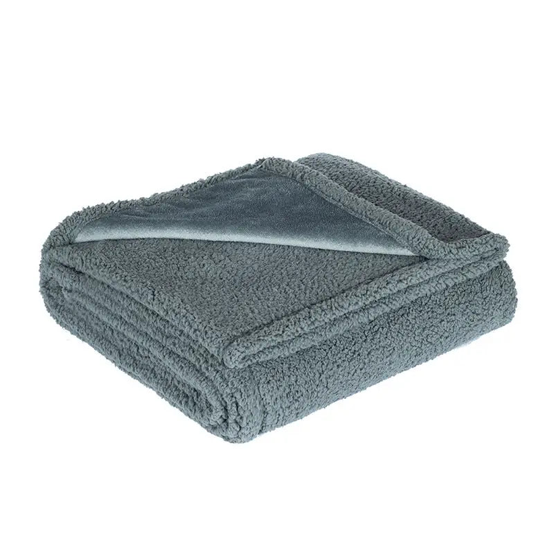 Folded large grey urine-proof pet blanket on white background for sofa and bed protection