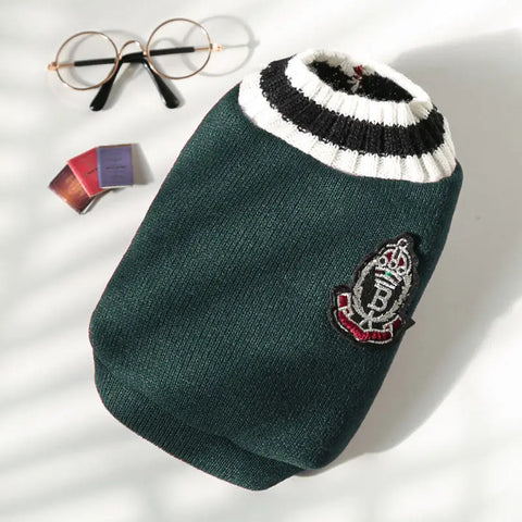 Four dog sweaters in gray, green, red, and brown with logo.