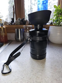 Gorilla Grip portable dog water bottle in black sitting on countertop