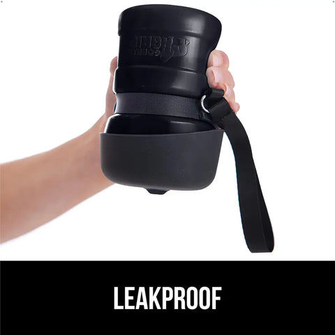 Folded leakproof Gorilla Grip portable dog water bottle held in hand
