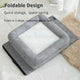 Gray pet bed with white cushion on light wooden floor.