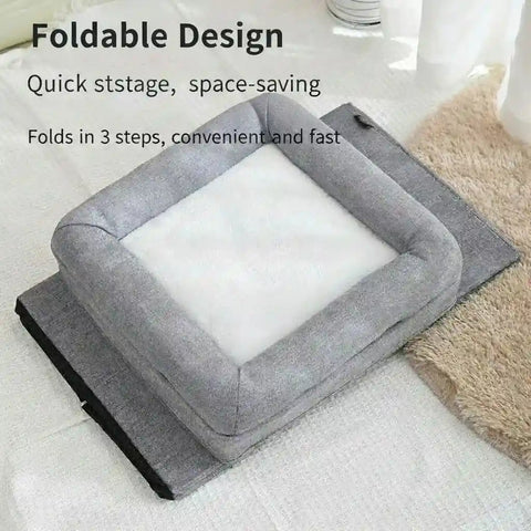 Gray pet bed with white cushion on light wooden floor.