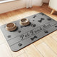 Gray absorbent pet food mat featuring bone and paw print icons with "Pet Food Mat" text.