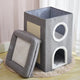 Gray pet playhouse with multiple levels on wooden floor.