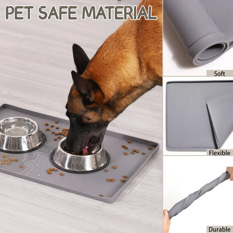 Gray pet safe silicone feeding mat demonstrating its soft, flexible, and durable material with a dog eating.
