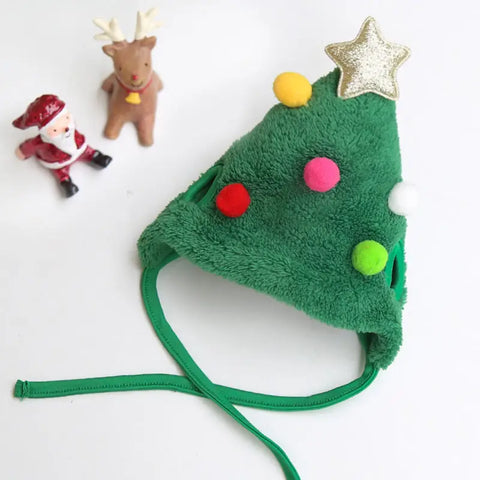 Green Christmas tree-shaped hat with colorful pom-poms.