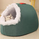 Green pet bed with white fur lining, featuring cat inside.