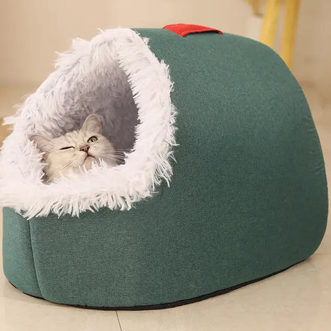 Green pet bed with white fur lining, featuring cat inside.