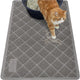 Overhead view of a grey Gorilla Grip cat litter mat capturing litter scatter outside a litter box