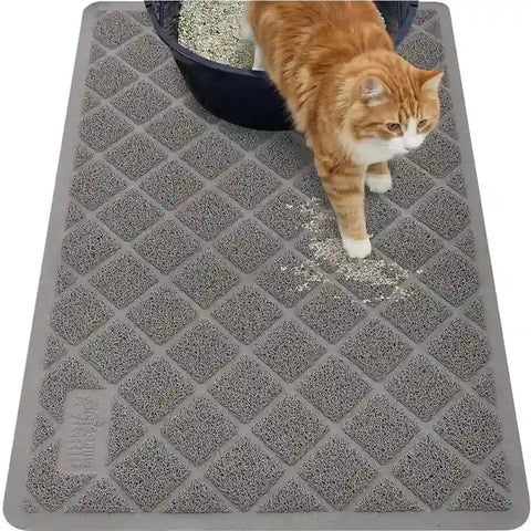 Overhead view of a grey Gorilla Grip cat litter mat capturing litter scatter outside a litter box