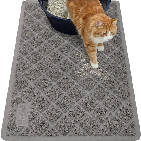 Overhead view of a grey Gorilla Grip cat litter mat capturing litter scatter outside a litter box