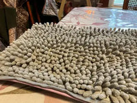 Detailed close-up of a grey chenille dog shammy towel, highlighting the thick, highly absorbent microfiber noodle-like texture designed for quick pet drying.