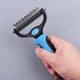 Hand holding pet grooming tool with blue handle and black bristle side.