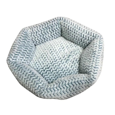Hexagonal pet bed with a textured pattern on white background.