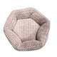 Hexagonal pet bed with pink and white chevron pattern.