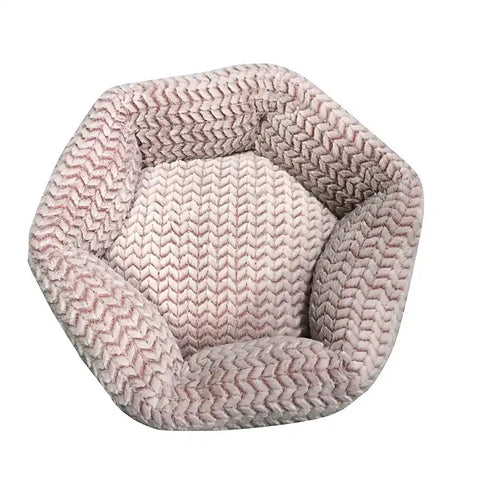 Hexagonal pet bed with pink and white chevron pattern.