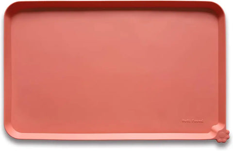 Burnt Coral reddish-pink silicone pet feeding placemat with spill-proof rim.