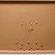 Butterscotch brown silicone pet food tray displaying water drops and dry kibble pieces.